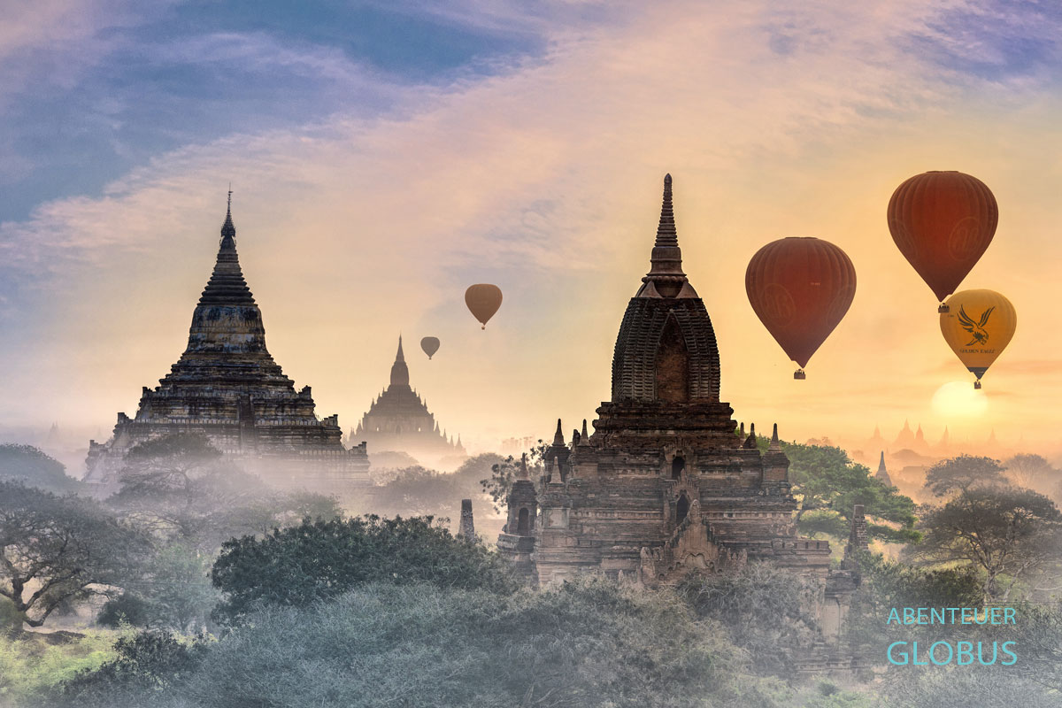 Im Sonnenaufgang gleiten Heißluftballons lautlos über die 2200 Tempel, Pagoden und Klöster in Bagan in Myanmar.