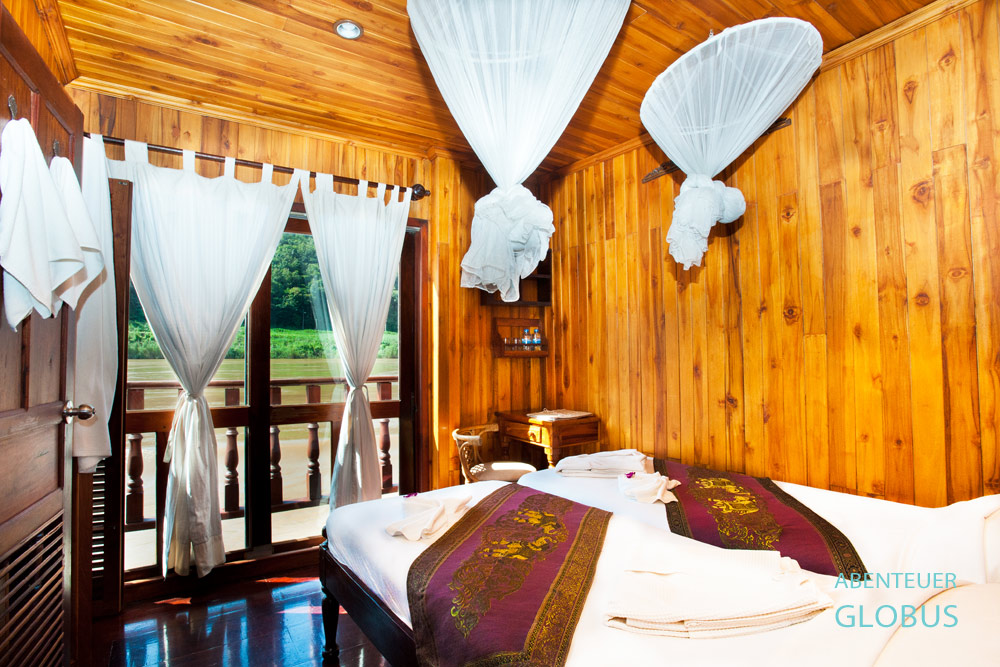 Der perfekte Rückzugsort: die Kabine mit dem französischen Balkon auf dem Flusskreuzschiff Mekong Sun vom Reiseunternehmen Lernidee.